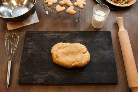 Gingerbread dough on black board. Pastry making, homemade bakery, culinary classes conceptの写真素材