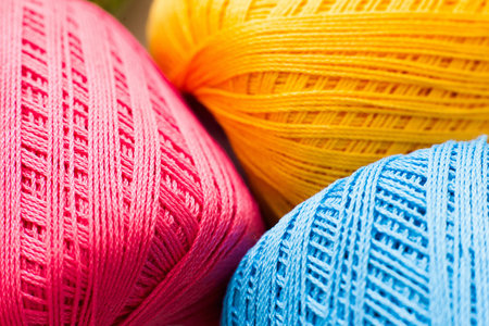 Colorful knitting thread texture, handiwork backdrop. Bright handiwork background, crochet iris pink, yellow and blue string, Leisure, hobby, needlework conceptの写真素材