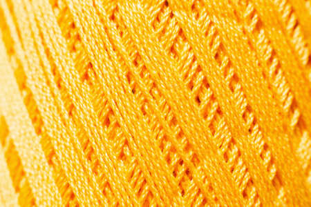 Orange knitting thread texture, handiwork backdrop. Bright handiwork background, crochet iris string, Leisure, hobby, needlework conceptの写真素材