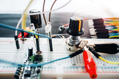 Prototyping electronic board with components and wires. Science experiment, robotics development conceptの写真素材