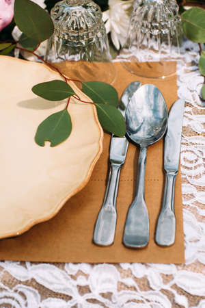 Silverware with porcelain plate on table, flat lay. Rich luxury dinner. Restaurant serving for banquet. Rank and fashion lifestyle conceptの写真素材