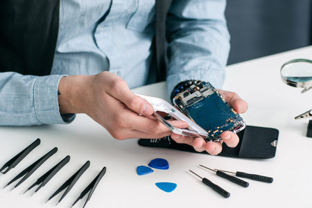 Smartphone Repair Shop Tool Electronic Technology Small Business Communication Fix Conceptの写真素材