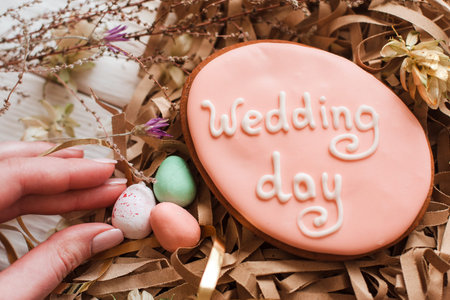 Handmade wedding cookie decorated with lettering top view. Preparing for wedding celebration....