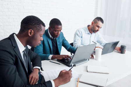 Applying for work permit abroad. Filling documents in the office for getting permission, opening schengen or visa.の写真素材