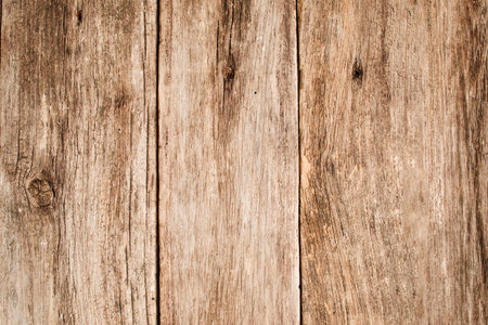 Light wooden table texture free space. Close up of shabby wooden background with vertical position...
