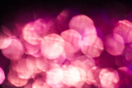 Abstract blurred light background, pink flare. Glitter in bokeh. Christmas wallpaper decorations...