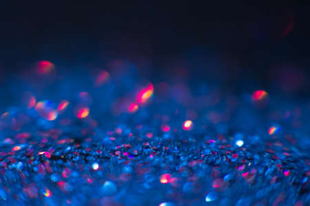 Abstract shining glitters blue makeup background. Blurred multicolored tinsel, selective focus with shallow depth of field. Glisten foil backdrop, christmas magic , eyeshadow closeup conceptの写真素材