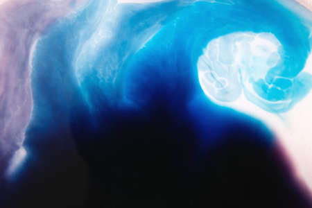 Abstract artistic background of colorful splotch similar to sea wave. Watercolor gradient from dark to light blue and purple shading offの写真素材
