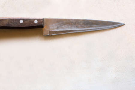 Cutting wooden desk with knife laying on it. Beginning of cooking process in kitchen, empty board, top view picture with free spaceの写真素材