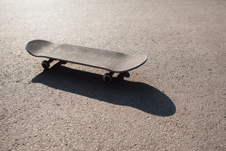 One skateboard on the road. Extreme sport challenge and skateboarder competition, short break after...
