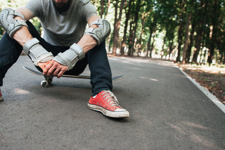 Professional skater after hard competitions. Extreme sport challenge and training, exhaustion and...