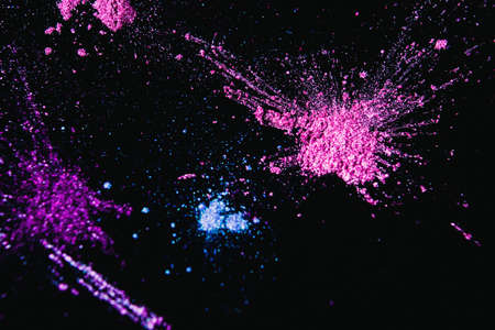 Colorful powdery splashes, top view. Professional abstract pigment cosmetics background and colourants for creative make upの写真素材