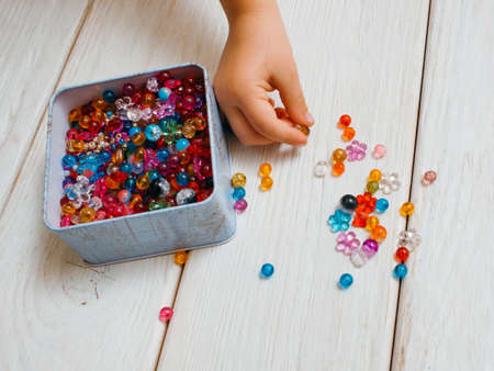 Art creation process. Girly hobby. Colorful decoration tools closeup, unrecognizable child artist. White background top view, creativity conceptの写真素材