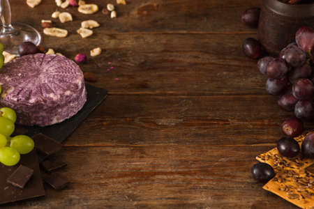 Food background of dairy gourmet products. Quality sort of cheese with assortment of appetizers, free spaceの写真素材