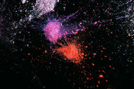 Colorful powdery splashes, top view. Professional abstract pigment cosmetics background and colourants for creative make upの写真素材