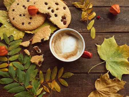 Autumn harvest. Fall leaves and berries assortment background. Hot beverage conceptの写真素材
