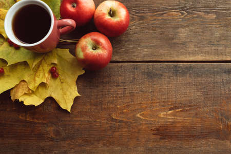 autumn coffee or tea warm leaves ripe harvest wooden surface background concept. Seasonal coziness. Disease preventionの写真素材