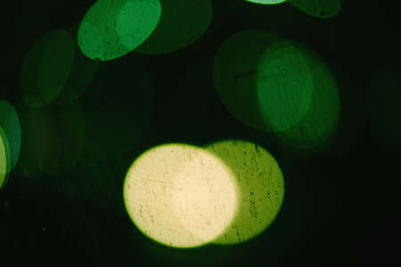 Bokeh blurring urban colours concept. Abstract background. Defocused lights. Shiny spots.の写真素材