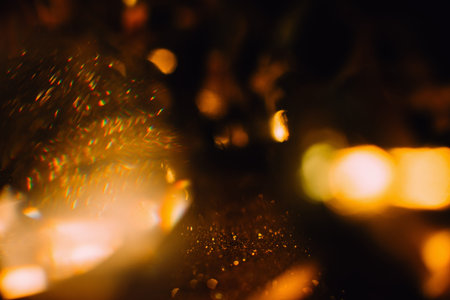 Festive abstract gold glitter defocused background. Blur bokeh lights. Christmas holidays...