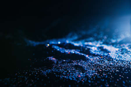 dark and blue abstract glitter background. Blizzard on cold planet surface conceptの写真素材