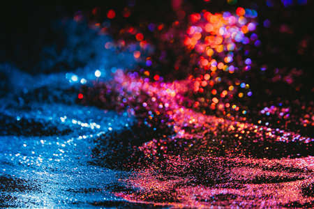 Multicolor abstract glitter background. Wind in desert. Red and blue sand. Fire and water elements conceptの写真素材