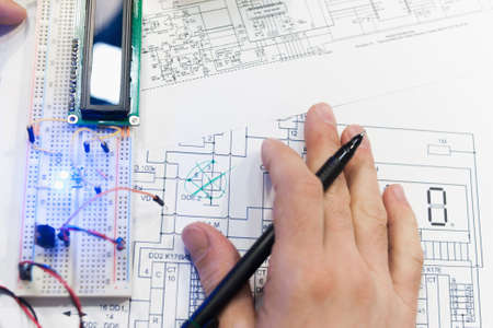 Paperwork electro scheme mechatronics breadboard concept. Robotics creation with microcontroller. Student experiment.の写真素材