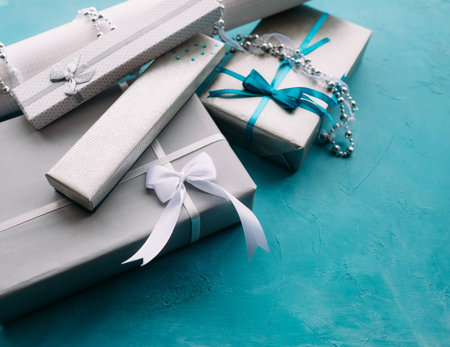 Gift boxes with jewelry presents inside. Tasteful wrapping conceptの写真素材