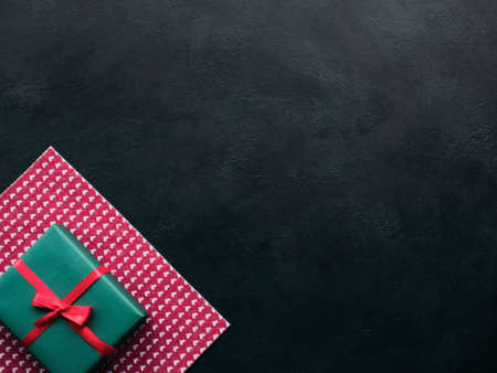 Top view of a Valentines day gift on dark background. Present of love. Copyspace conceptの写真素材