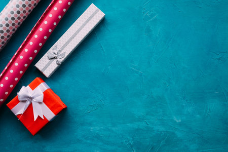 holidays gift assortment on bright blue background. game of contrasts. present wrapping for birthday, new year, christmas, thanksgiving, valentines day and other occasion.の写真素材