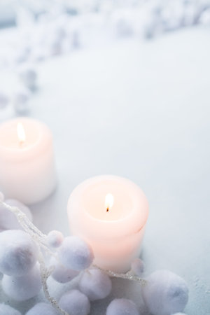 candles festive light on the white background. concept of hope and purity. winter colors.の写真素材