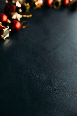 festive christmas toys on dark background. atmosphere of winter holidays.の写真素材