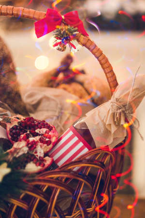 Christmas goods in a basket. professional handmade assortment of delicious festive food. Great present on different holidays. Preparation for holidays.の写真素材