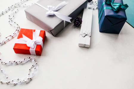 Selection of gift boxes on white background. New Year decor concept. Beautifully wrapped presents to create holiday atmosphereの写真素材
