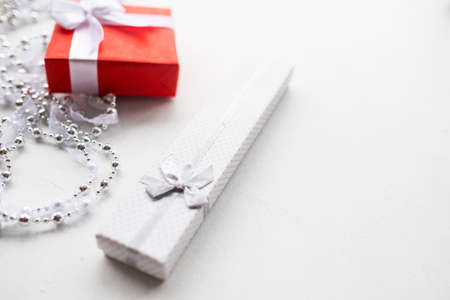 fashionable accessorize gift on white background. expensive and luxury jewelry present for birthday, new year, christmas, valentines day, and other occasionの写真素材
