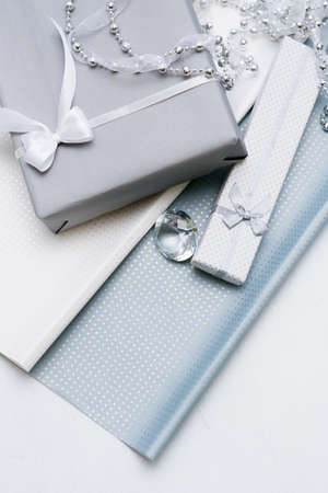 luxury jewelry gifts for top class on grey background. professional present wrapping for toffs on birthday, new year, christmas, thanksgiving, valentines day and other holidays.の写真素材