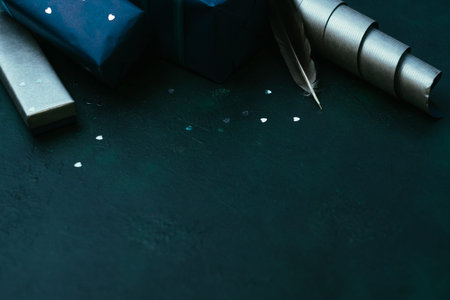 Christmas and New year gifts for man on dark background. Magic of the festive time of the year conceptの写真素材