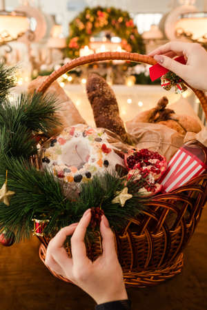Christmas goods in a basket. professional handmade assortment of delicious festive food. Great present on different holidays. Preparation for holidays.の写真素材