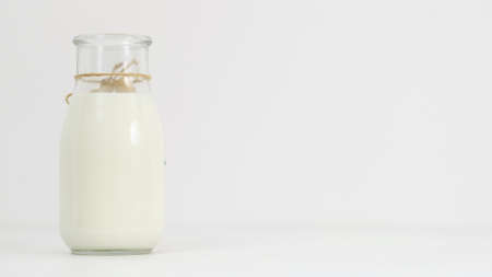 milk, kefir, greek yogurt bottle on white background. Fresh and fermented dairy products. Copy space conceptの写真素材