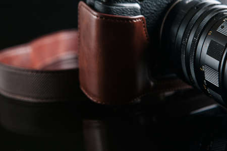 mirrorless camera on black background. professional photography courses. lifestyle of creative peopleの写真素材