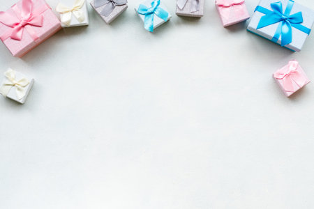 Small compliment presents on white background. Row of gift boxes. Little pleasant surprise. Copy space conceptの写真素材