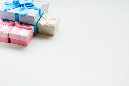 family presents. Gift boxes for parent and kids on white background. Celebration time. Seasonal...