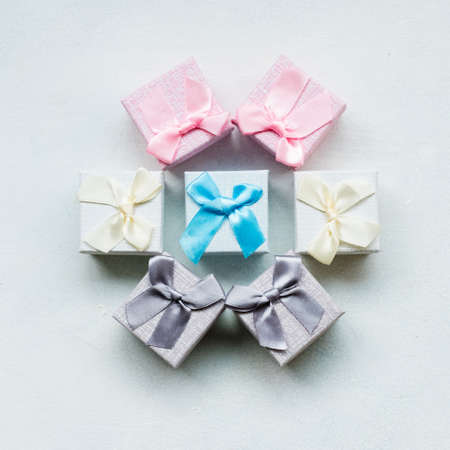 Present wrapping craft. Creative ideas of gifts packaging. Various decorative designs. Circle of boxes on white backgroundの写真素材