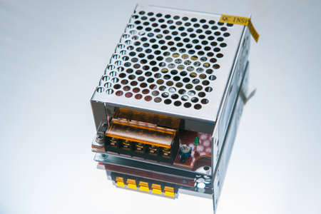 Transformer 12W on white background. converts high voltage into low-voltage. engineering componentの写真素材