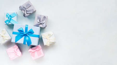 Seasonal gifts sale. Holiday shopping. Buy great presents at discount. Festive boxes on white backgroundの写真素材