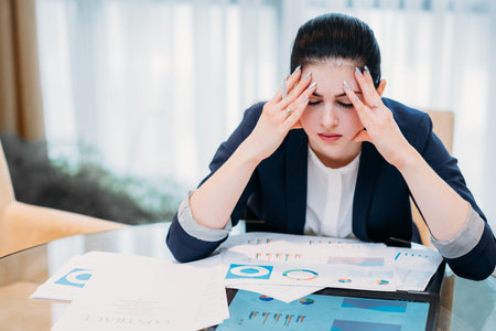 Stress headache and fatigue. business career downfalls. tired woman sitting in office her eyes...