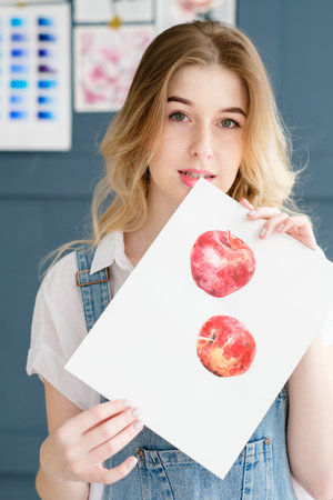 creative leisure. painting hobby. artful personality. talented girl holding her watercolor drawing...