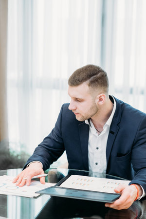 company executive, business analyst or corporate manager working in office. documents review, paperwork conceptの写真素材