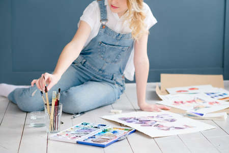 art painting hobby. creative leisure. girl drawing a picture. talent inspiration creation and self expression conceptの写真素材