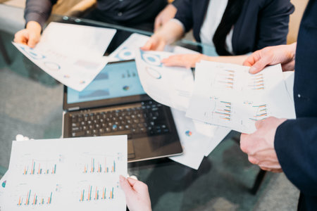 office meeting. business team brainstorming. group of workers study documents with graphs and diagrams. information analysisの写真素材