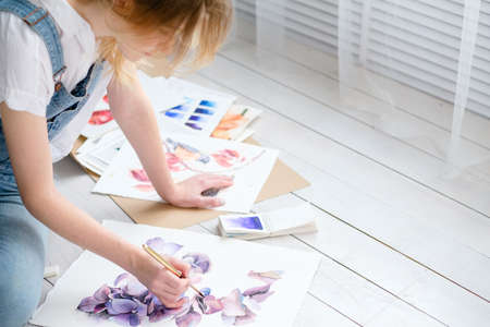 art painting hobby. creative leisure. girl drawing a picture. talent inspiration creation and self expression conceptの写真素材